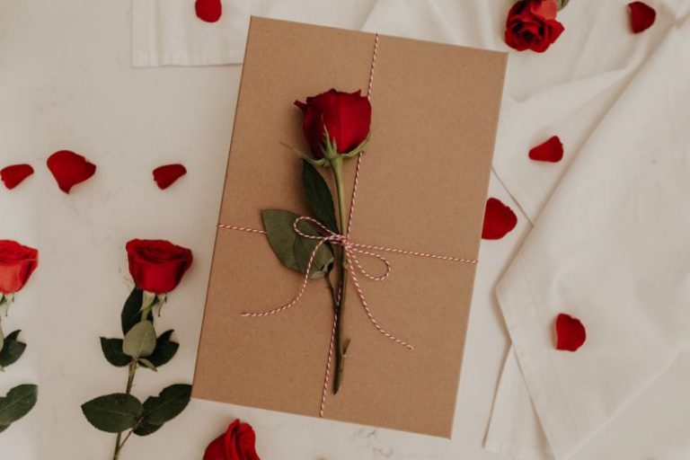 Surprise Gift - red rose on brown envelope