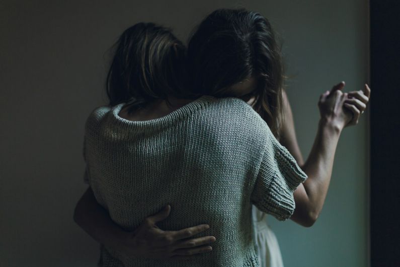 Supportive Hug - two women hugging each other