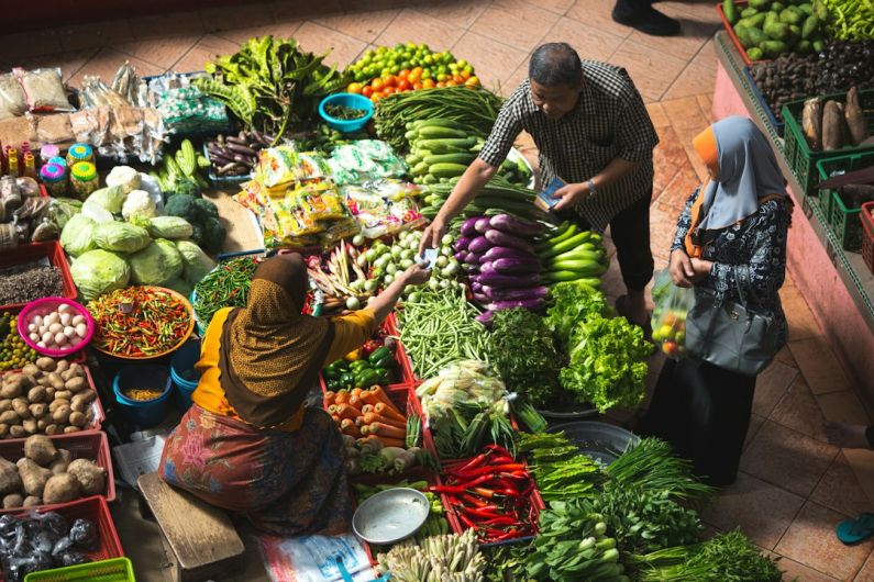 Local Market - person standing near vegetables