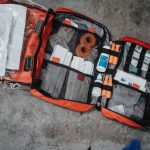 First Aid Kit - orange white and black bag