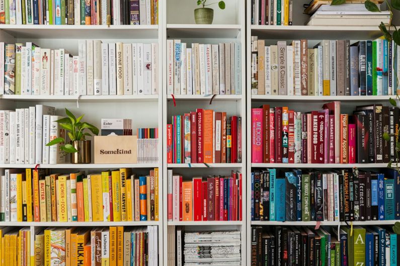 Library Books - books on white wooden shelf