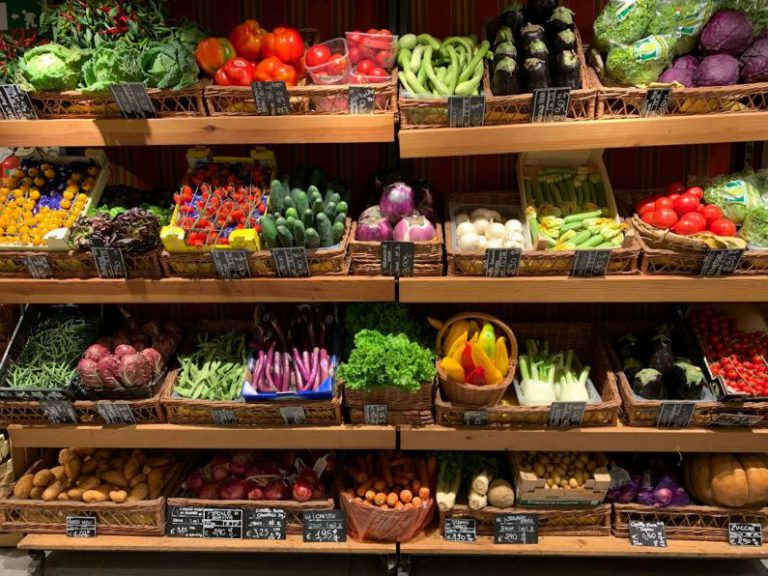 Local Shop - assorted fruits on brown wooden rack