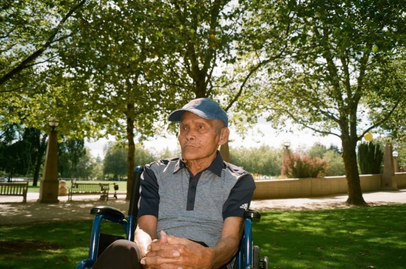 Elderly - a man sitting in a park