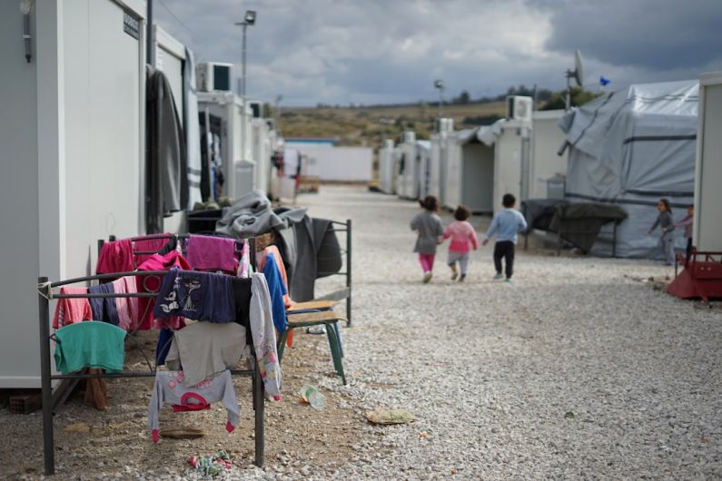 Refugee - people walking on street during daytime